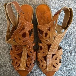 L’ Artiste wedge sandals.